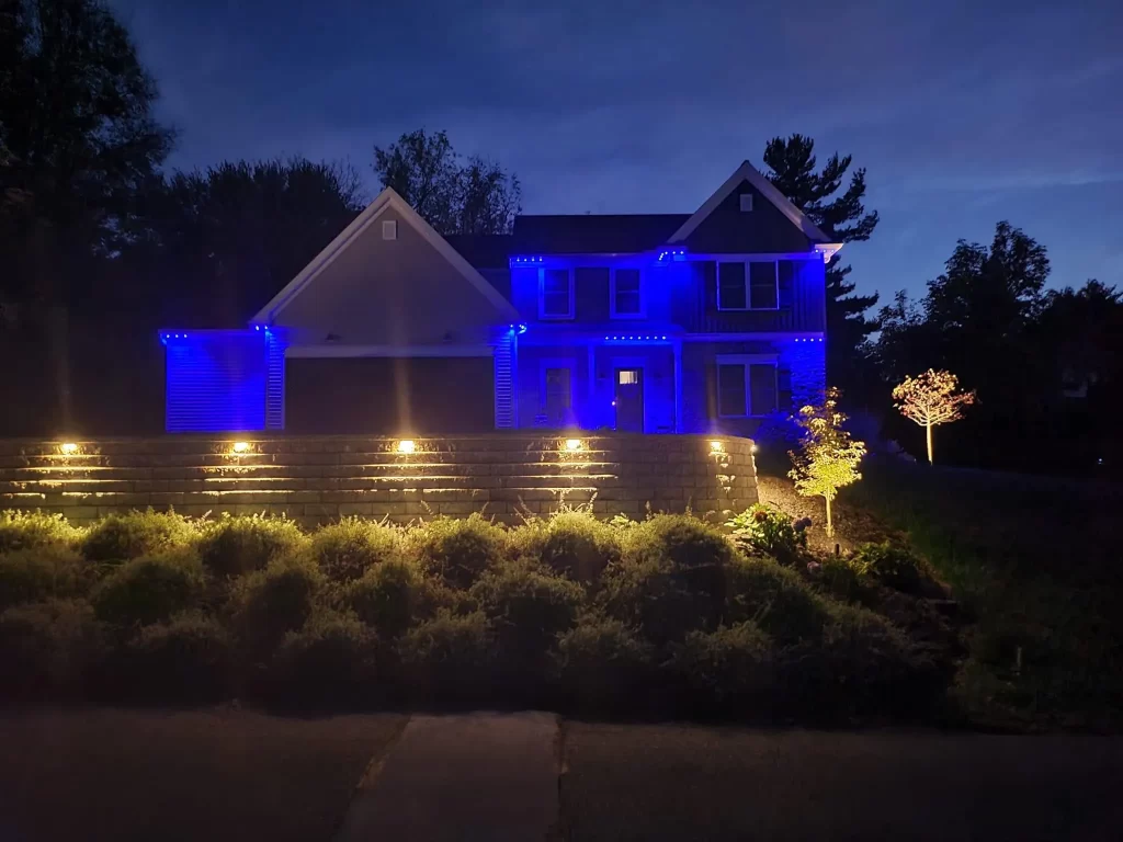 Finished lighting installation. Beautiful house lit at night.